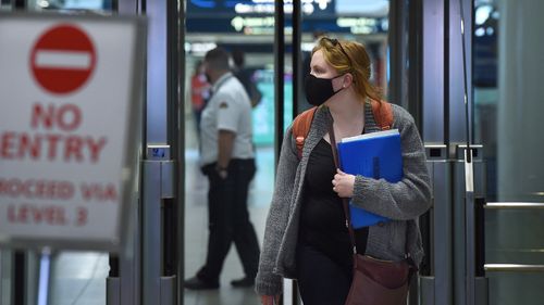 A passenger arrives at Sydney airport.