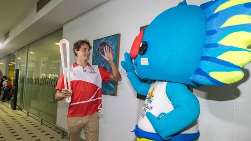 Cam McEvoy with mascot Borobi in Brisbane today. (AAP)