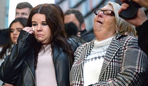 An unnamed family relation stands next to Sue Eismann (right) the mother of Nicola Fellows, who was found murdered alongside her friend Karen Hadaway, outside the Old Bailey in London after paedophile Russell Bishop was found guilty of the Babes in the Woods murders, ending the two families' 32-year fight for justice.