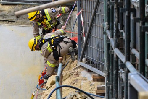 Fire-fighters conducted a high-angle rescue to free two of the trapped men.