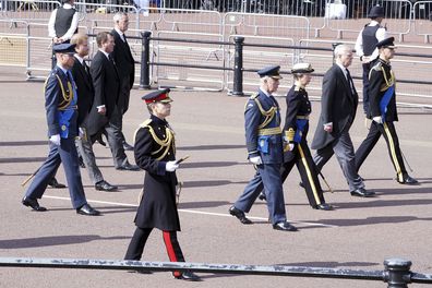 Britain's King Charles III, Princess Anne, Prince Andrew, Prince Edward, Prince William, Prince Harry and Peter Phillips follow the coffin of Queen Elizabeth II, draped in the Royal Standard with the Imperial State Crown placed on top, as it is carried on a horse-drawn gun carriage of the King's Troop Royal Horse Artillery, during the ceremonial procession from Buckingham Palace to Westminster Hall, London, where it will lie in state ahead of her funeral on Monday. (Ian West/Pool Photo via AP)
