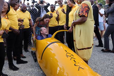 Prince William and Kate meet The Jamaica National bobsleigh team during a visit to Trench Town, the birthplace of reggae music, on day four of the Platinum Jubilee Royal Tour of the Caribbean on March 22, 2022 in Kingston, Jamaica. 