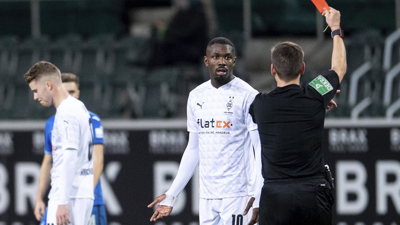 Bundesliga player Marcus Thuram banned five games for spitting in opponent's face