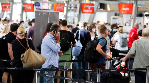 People waiting to check in with Jetstar at The Sydney Airport