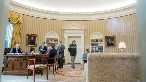 President Trump speaks with Russian President Vladimir Putin on the phone in the Oval Office on Jan. 28, 2017. Photo: AP