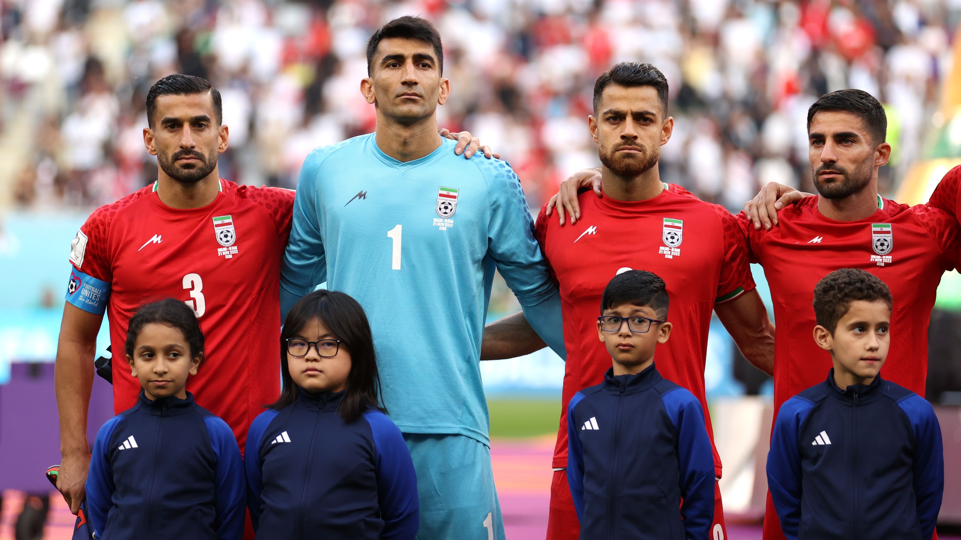 DOHA, QATAR - NOVEMBER 21: Iran players line up for the national anthem prior to the FIFA World Cup Qatar 2022 Group B match between England and IR Iran at Khalifa International Stadium on November 21, 2022 in Doha, Qatar. (Photo by Julian Finney/Getty Images)