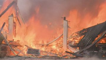 A monster fire that tore through three homes in Brisbane has left three people in hospital, including two firefighters.