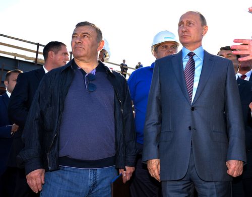 Russian President Vladimir Putin, is pictured alongside businessman and billionaire Arkady Rotenberg, who is the brother Boris Rotenberg.
