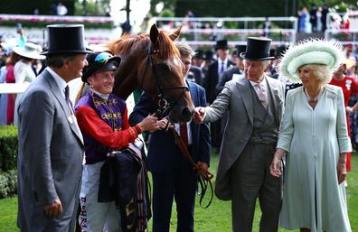 Desert Hero ridden by Tom Marquand with owners HM the King and HM The Queen after The King George V Stakes during day three of Royal Ascot 2023 at Ascot Racecourse on June 22, 2023 in Ascot, England 