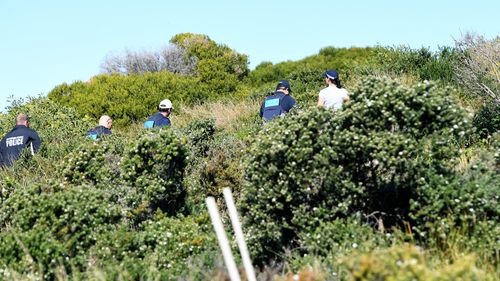 Police are seen at the home of Kings Cross club owner John Ibrahim during a police operation in Sydney. (AAP)