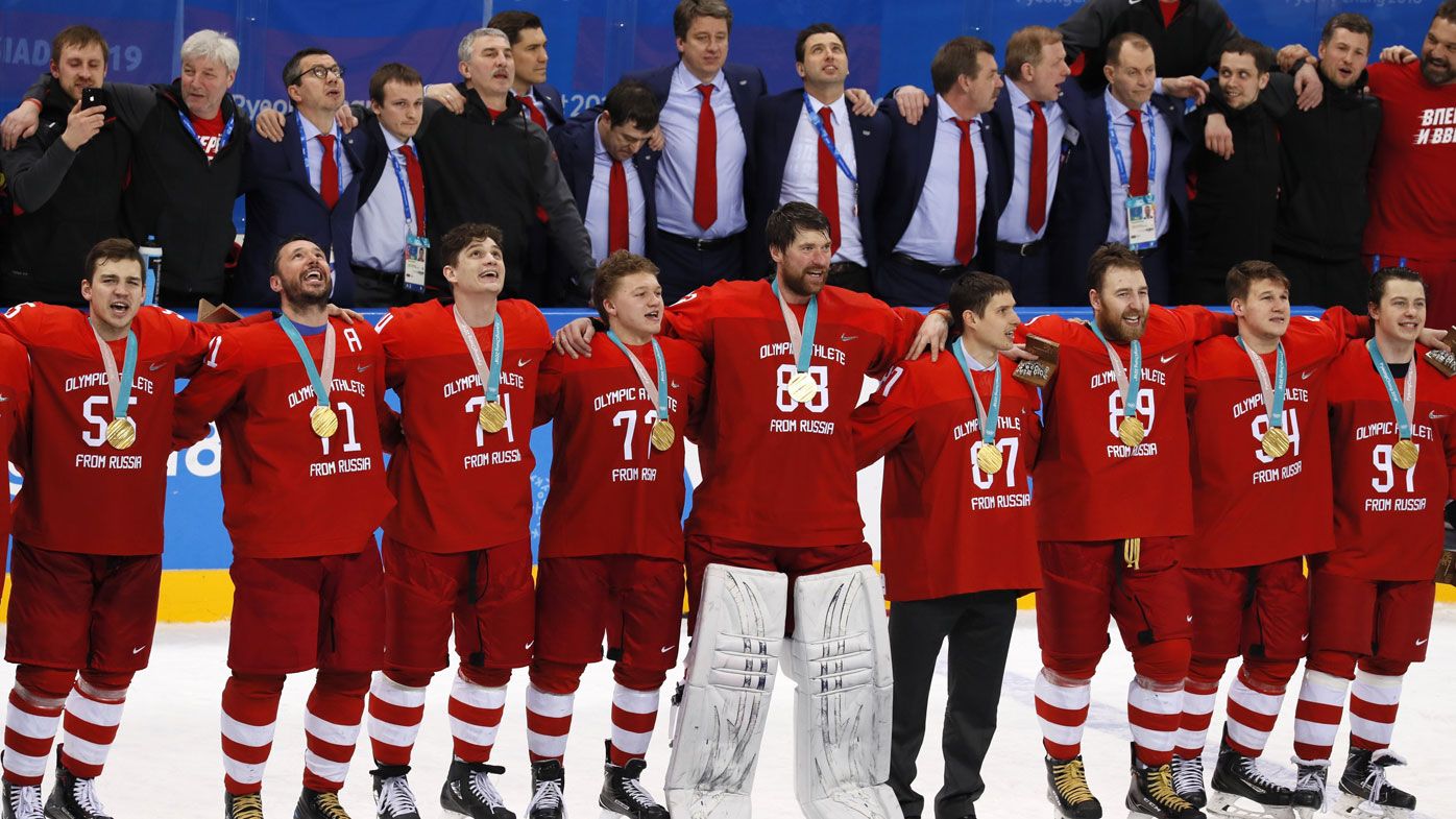 Russian ice hockey players sing banned national anthem after gold medal win over Germany
