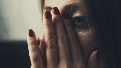 Depressed young woman crying