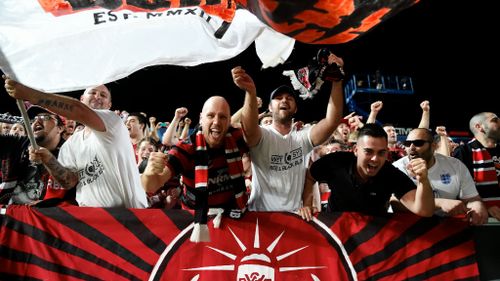 Wanderers fans celebrate the club's win. (AAP)