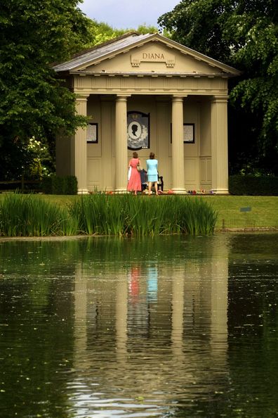 Visitors look at the Diana Shrine June 28, 2001 on Oval Lake as Althorp Estate is re-opened to the public in Great Brington, outside London, UK 