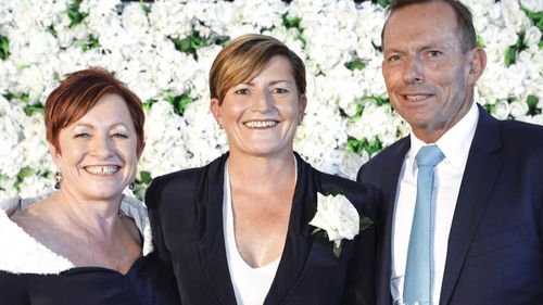 Tony Abbott with his sister Christine Forster and her wife Virginia Edwards. Ms Forster is expected to run in the seat. (AAP)