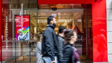 People walk past a Medibank outlet in Sydney.