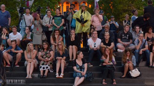 Several hundred have joined together in Martin Place for the twilight vigil. (AAP)