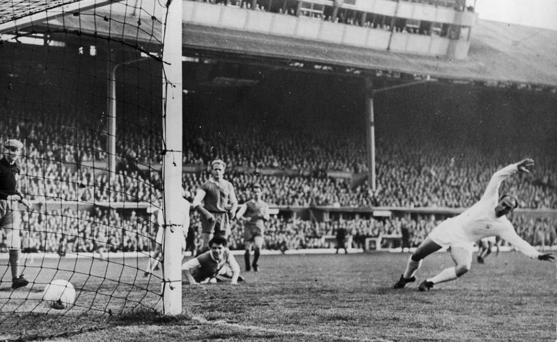 Alfredo Di Stefano of Real Madrid scores the first goal in the 1960 European Cup final at Hampden Park.