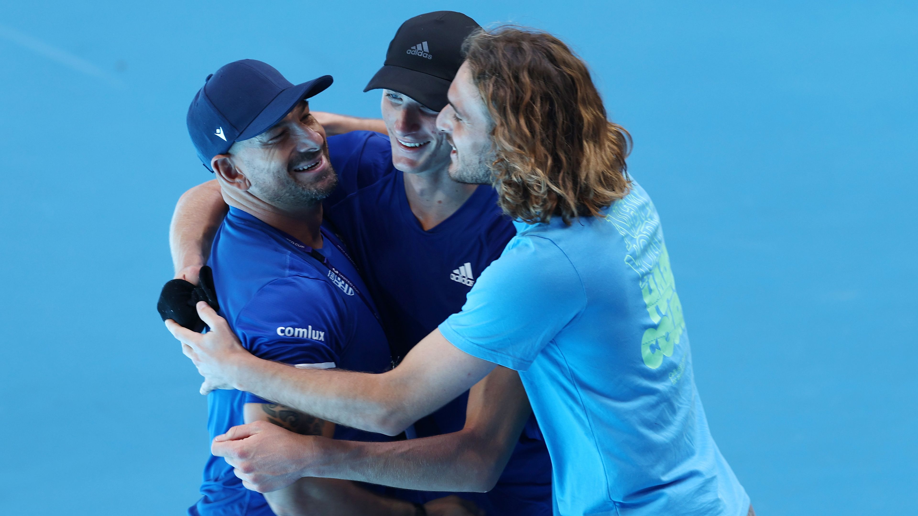 Stefanos Sakellaridis of Greece is surrounded by his team after winning his men&#x27;s singles match against Zizou Bergs.