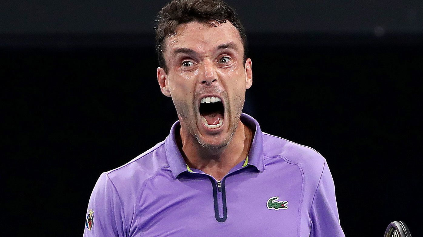 Roberto Bautista Agut roars in celebration after beating Thanasi Kokkinakis in the semi final of the Adelaide International