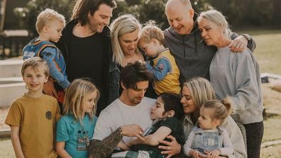 Jimmy Rees' family surrounds nephew Rye in family picture.