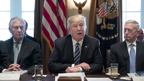 President Donald Trump sits alongside Secretary of Defense James Mattis (right) in the Cabinet Room of the White House in March, 2017. (Getty)
