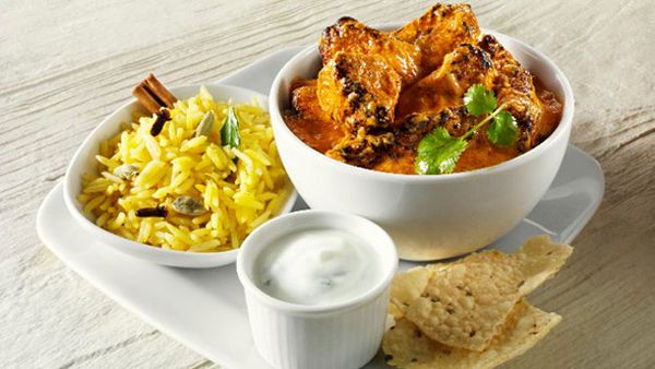 Lamb curry with spiced rice and yoghurt sauce