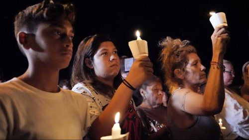 Mourners participate in a candlelight vigil held for the victims of a fatal shooting at the First Baptist Church of Sutherland Springs. (Image: AAP)