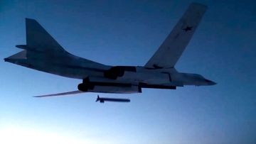 A Russian Tu-160 strategic bomber fires a cruise missile at test targets