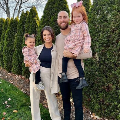 Bass with his wife Sydney and their two young daughters.