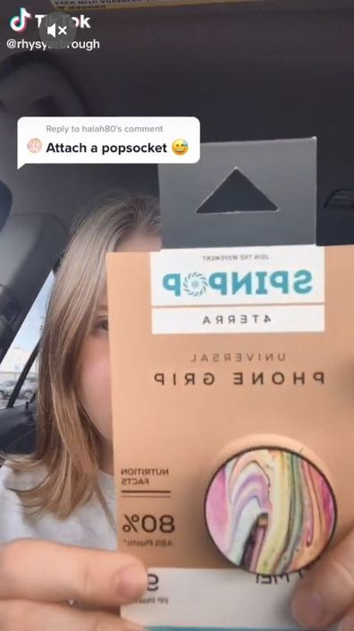She used a PopSocket in place of her prosthetic ear. 