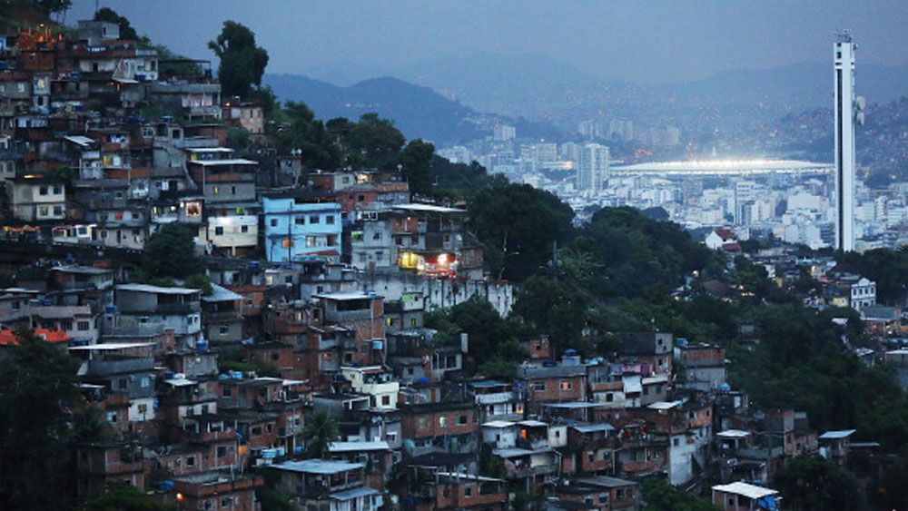 A Rio favela with the Olympic Stadium in the background. (Getty) 