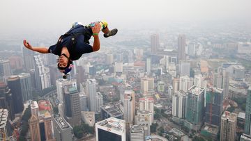 In this 2013 file photo, base jumper Vince Reffet, leaps from the 300-metre open deck of the Malaysia&#x27;s landmark Kuala Lumpur Tower.