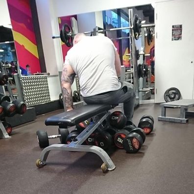 gym goer using all the weights