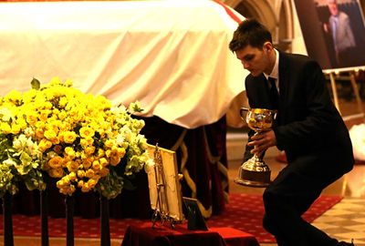 A Melbourne Cup was placed beside Bart's coffin.