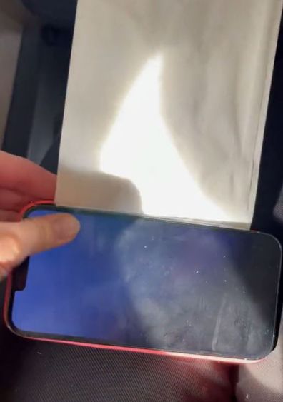 TikTok Travel Hack: Use a Sick Bag As a Phone Stand