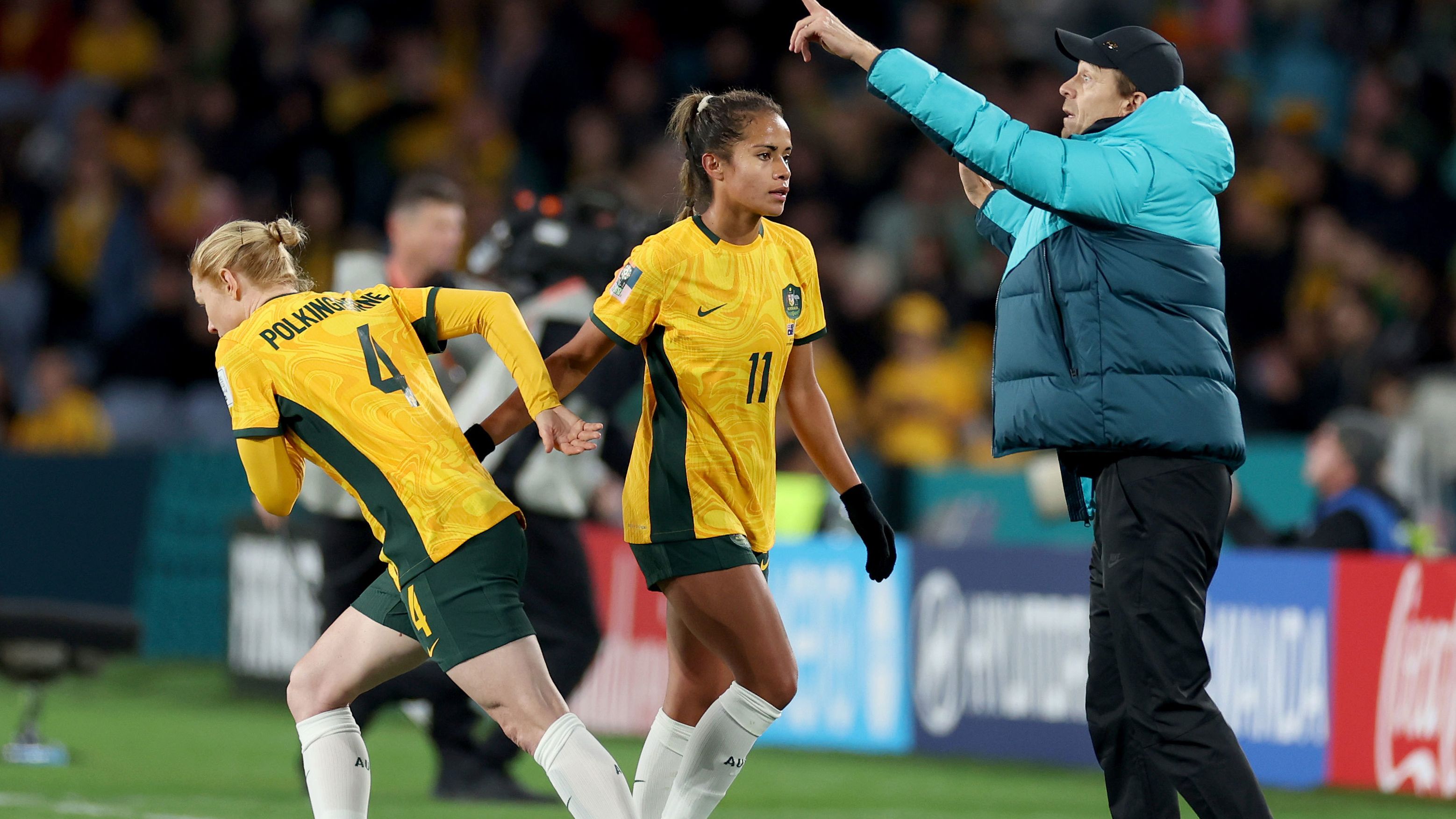 Clare Polkinghorne is brought on for Mary Fowler while Matildas coach Tony Gustavsson gives the team instructions during the second half of their clash with Ireland.