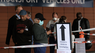 A sign explaining COVID-19 screening procedure is posted outside the Royal Melbourne Hospital on March 11, 2020 in Melbourne, Australia. (Photo by Luis Ascui/Getty Images)