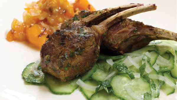 Curried spice lamb chops with grilled peach chutney and cucumber mint salad
