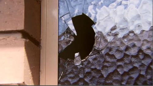 Ricocheting bullet went straight through elderly couple's toilet window. (9NEWS)