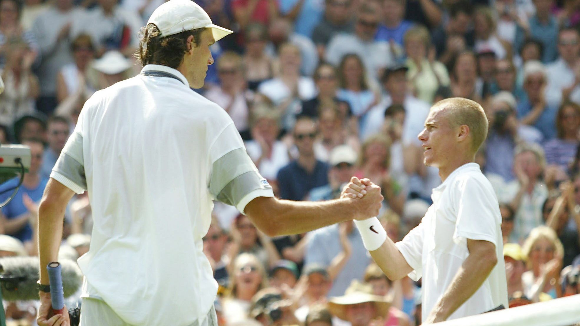 Towering tennis giant who stunned Lleyton Hewitt at Wimbledon retires 21 years later