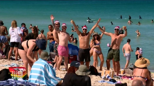 Many flocked to the beach to spend the hot day in the water.