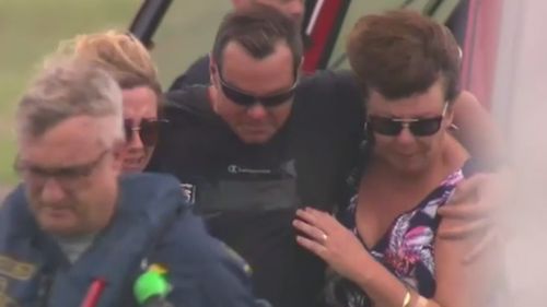 An emotional Ruben McDornan is reunited with his wife. (9NEWS)