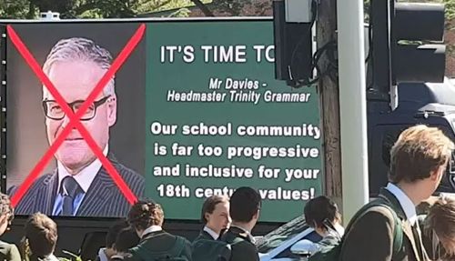 A truck ad calling for Dr Davies to stand down was driven outside Trinity last month. (9NEWS)