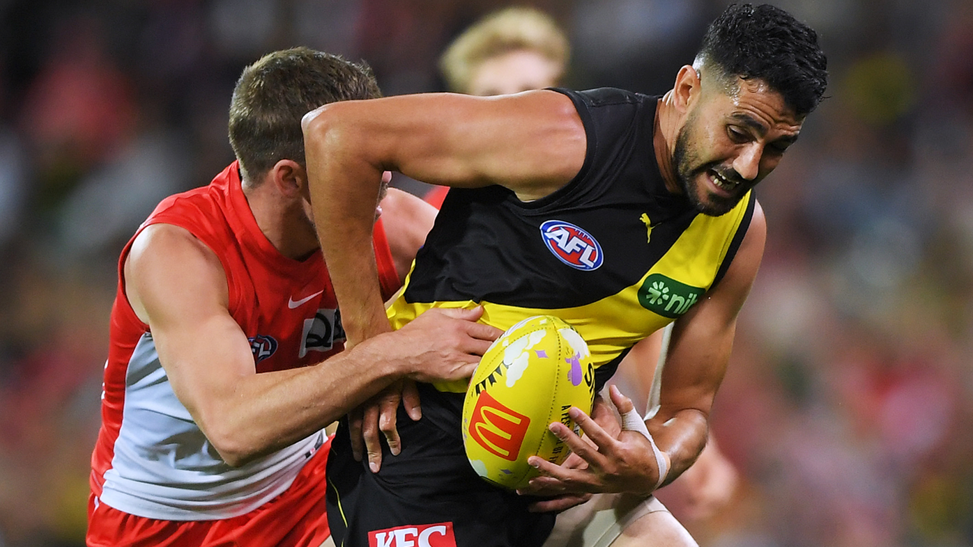 Marlion Pickett is tackled by Jake Lloyd during the round five AFL match between Sydney Swans and Richmond Tigers.