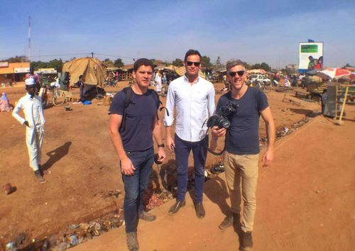 Tom Steinfort with some of the crew in Burkina Faso. (9NEWS)