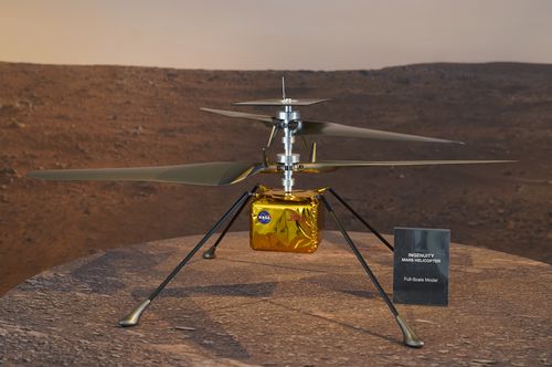 A full-scale model of the Mars Helicopter Ingenuity is displayed for the media at NASA's Jet Propulsion Laboratory (JPL).  (AP Photo/Damian Dovarganes)