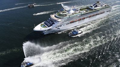 P&O Cruises Australia's flagship Pacific Explorer is led into Sydney Harbour by fire tugs on April 18.