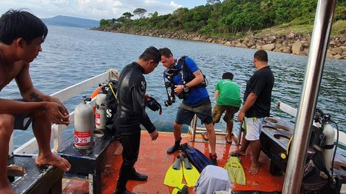 Police officers and foreigners, part of the search team, prepare to hunt for missing British backpacker Amelia Bambridge at Koh Rong, in Preah Sihanouk province, Cambodia.