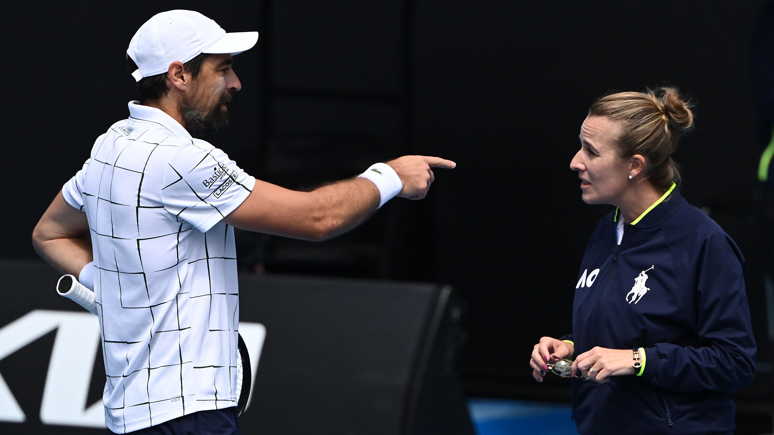 MELBOURNE, AUSTRALIA - JANUARY 19: Jeremy Chardy of France speaks to chair umpire Miriam Bley in their round two singles match against Daniel Evans of Great Britain during day four of the 2023 Australian Open at Melbourne Park on January 19, 2023 in Melbourne, Australia. (Photo by Quinn Rooney/Getty Images)